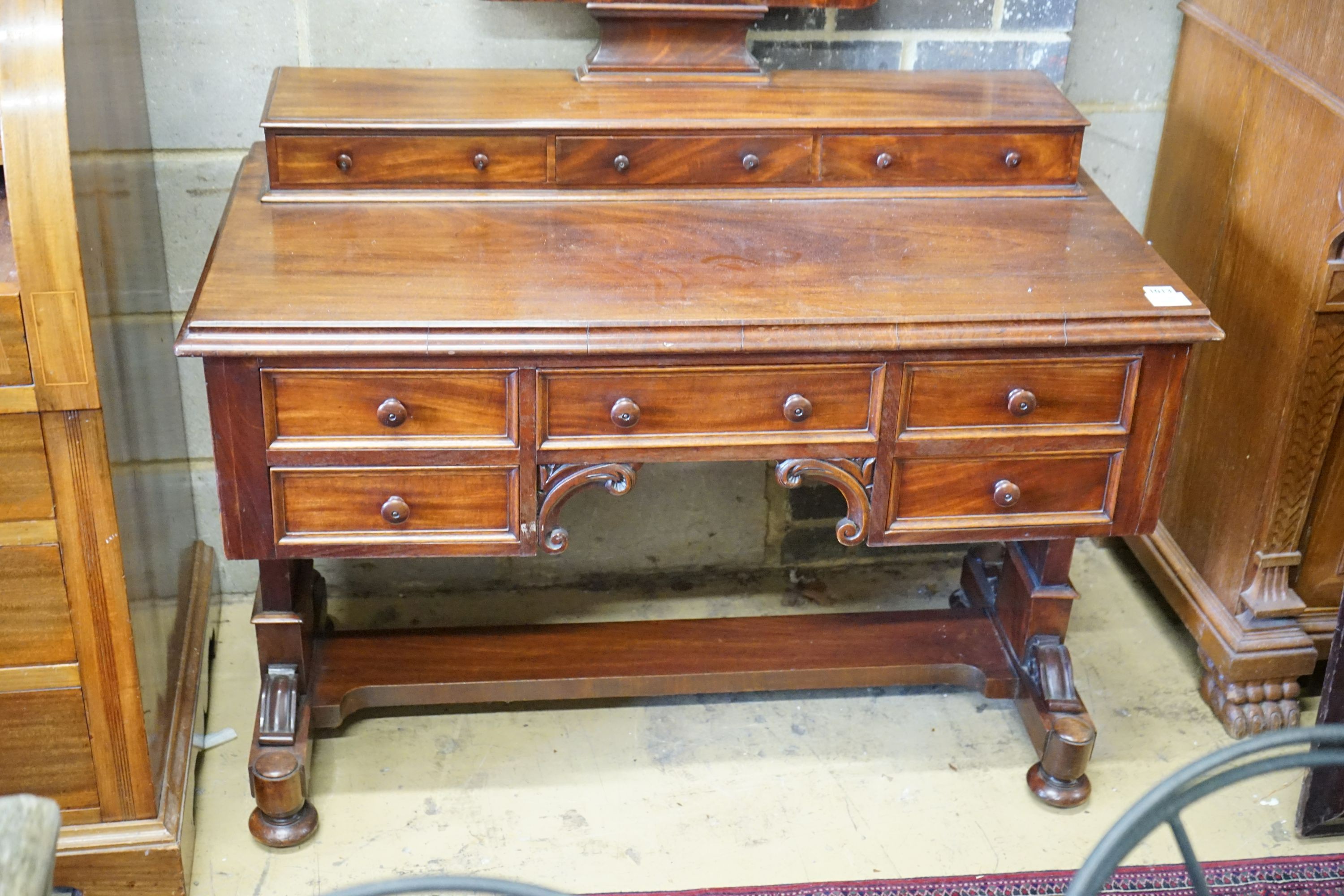 A Victorian mahogany kneehole dressing table, width 106cm, depth 55cm, height 144cm